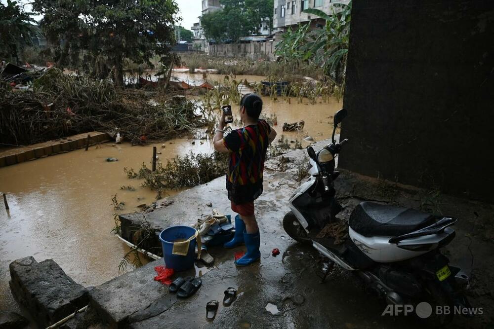 中国南部洪水で39人死亡、復旧作業進む中で新たな台風接近